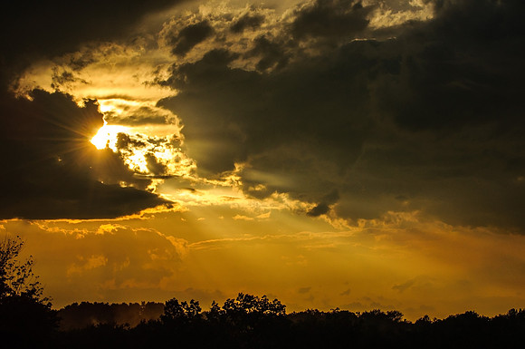Sun piercing through the clouds at Oxford Connecticut